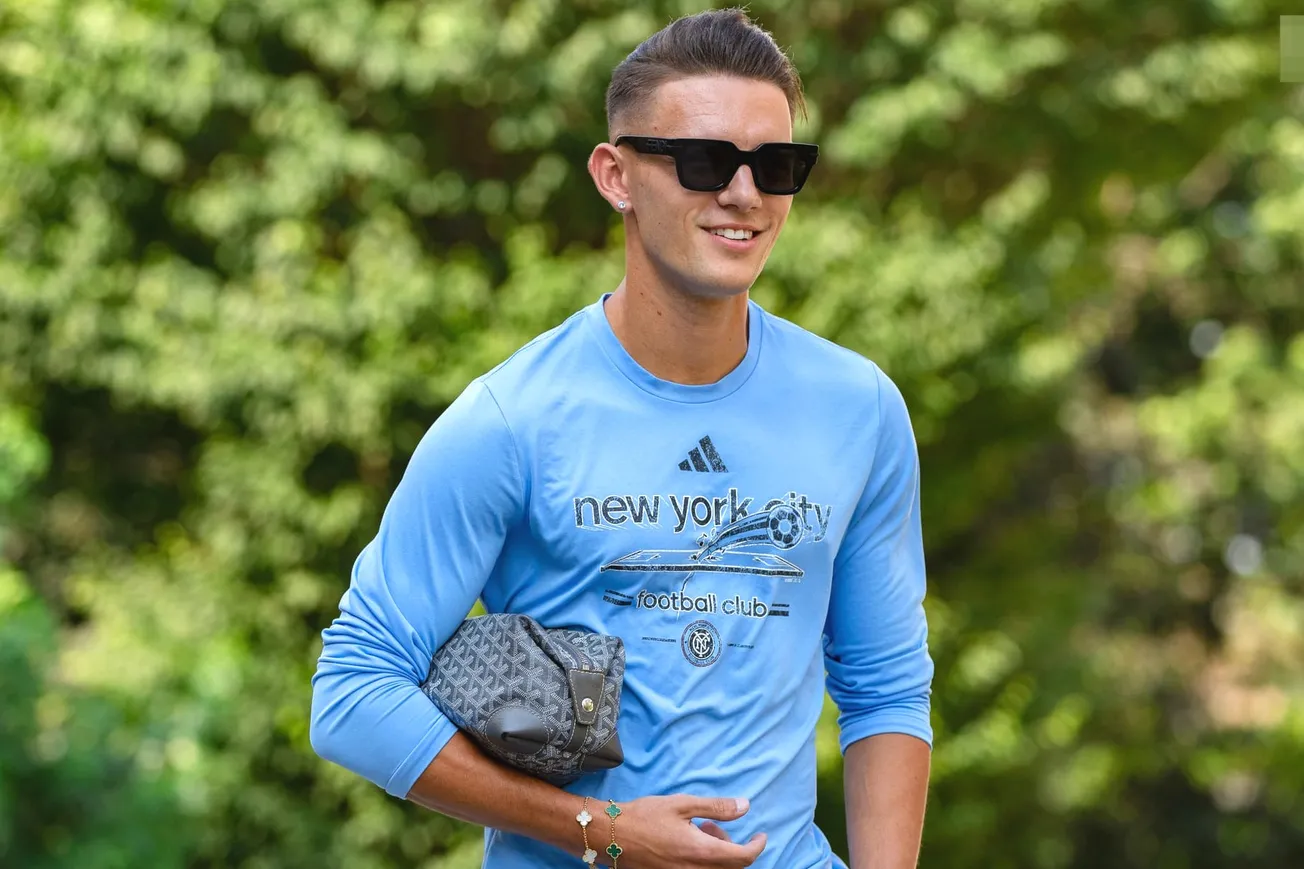 NYCFC attacking midfielder Hannes Wolf wears sunglasses and a New York City FC long-sleeve t-shirt as he approaches Yankee Stadium before the start of a game.