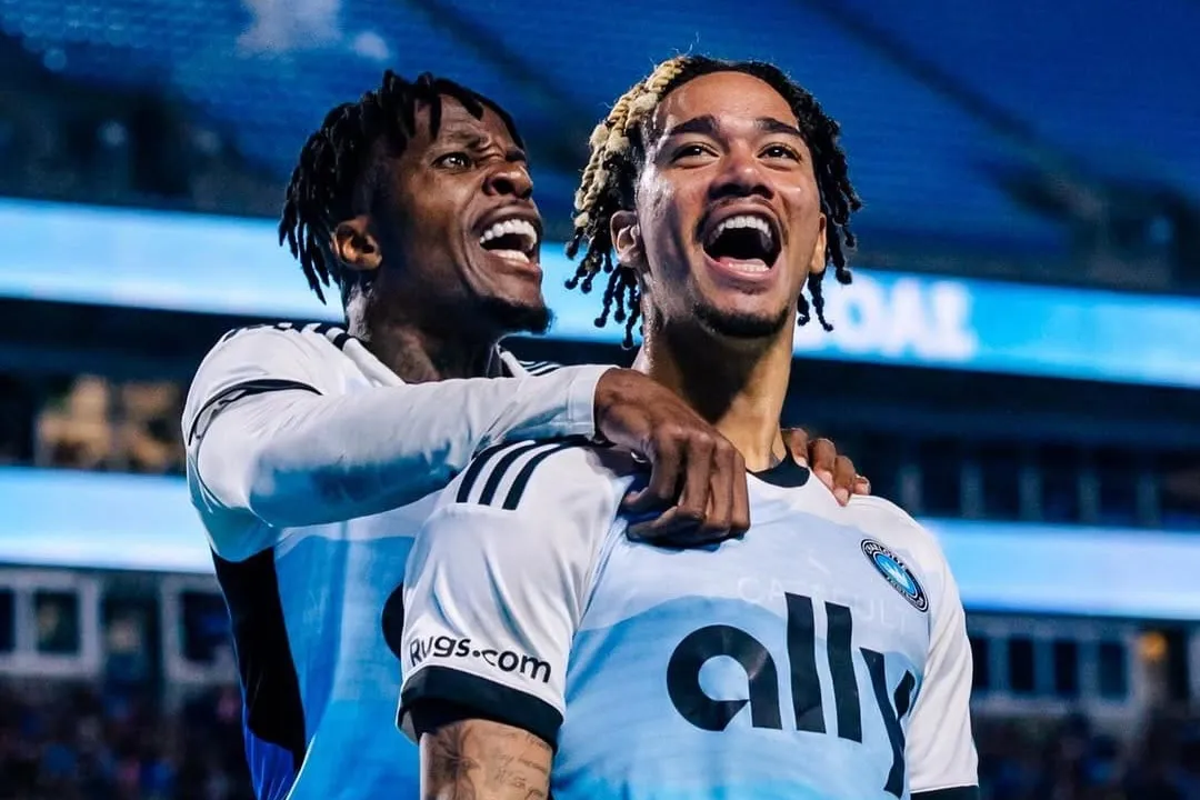 Wilfried Zaha and Idan Toklomati of Charlotte FC celebrate a goal