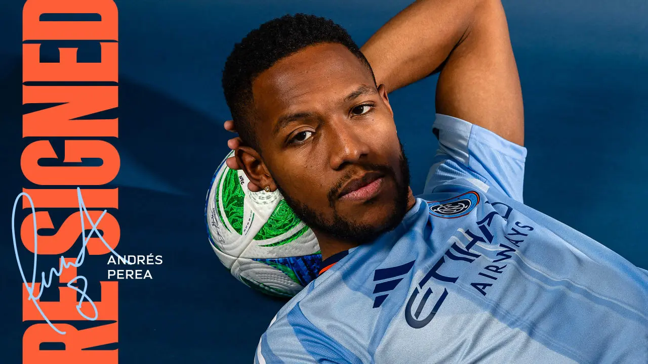 Andrés Perea in a light blue New York City FC jersey leaning on a soccer ball