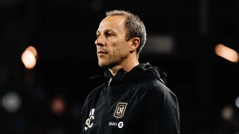 Steve Cherundolo, head coach of LAFC, during a match in a black jacket.